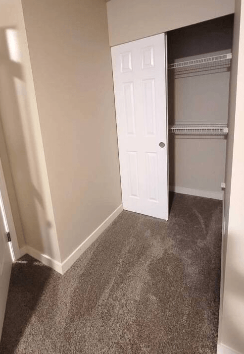 a room with a closet and a door