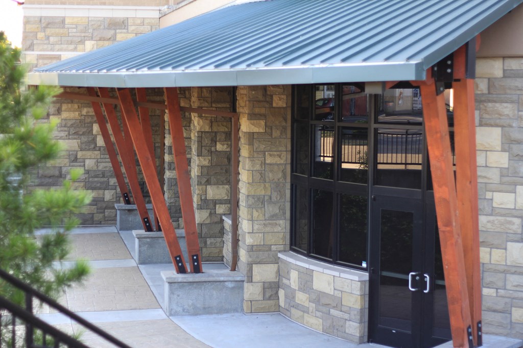 the front of a building with a metal roof