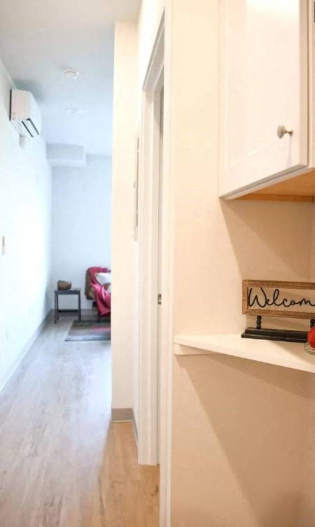 a hallway with a welcome sign on the wall