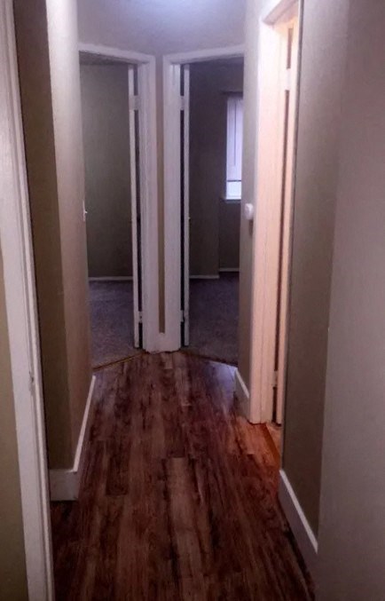 a hallway with a hard wood floor