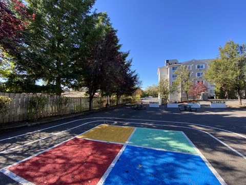 A colorful playground in the middle of a street.