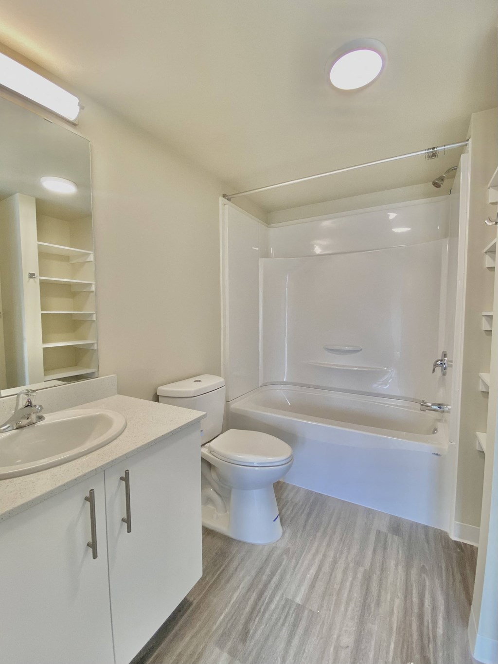 a bathroom with a toilet and a sink and a bath tub
