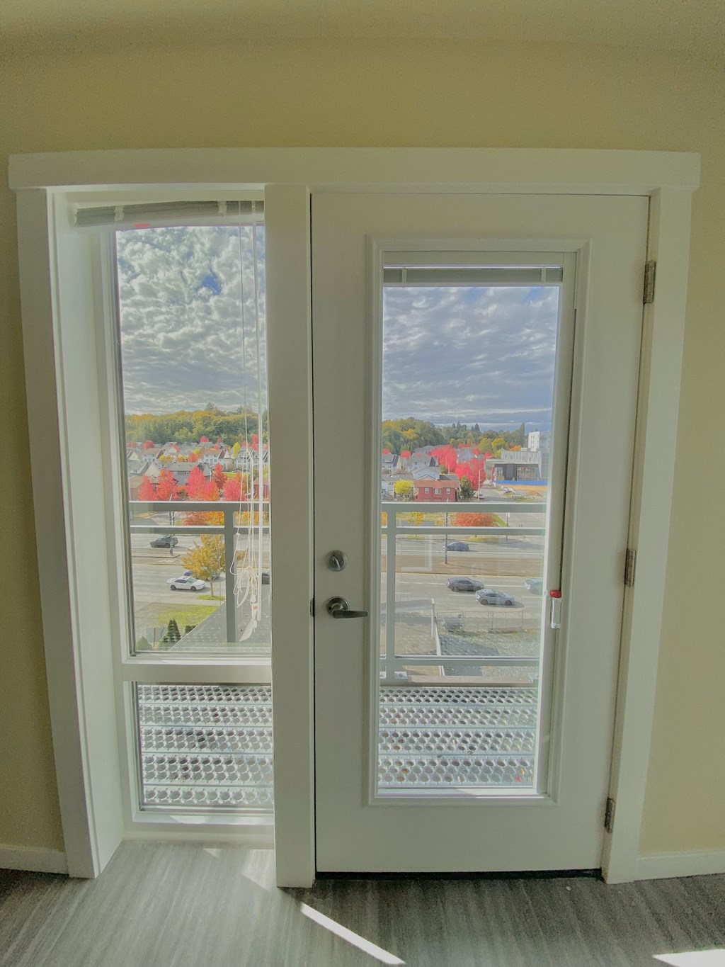 a pair of doors with a view of a balcony