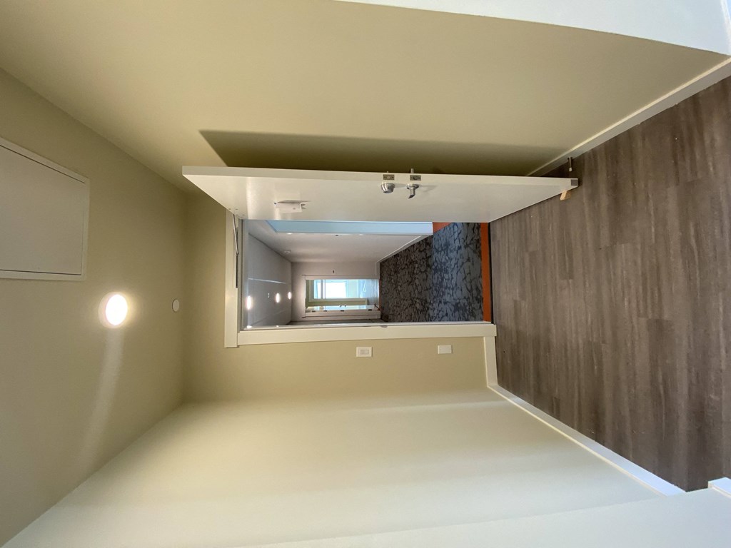 a view of the living room from the hallway of a house