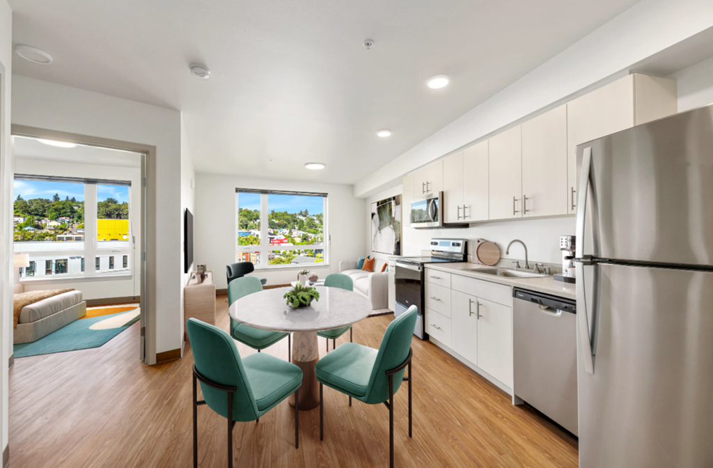 a kitchen and dining room with a table and chairs