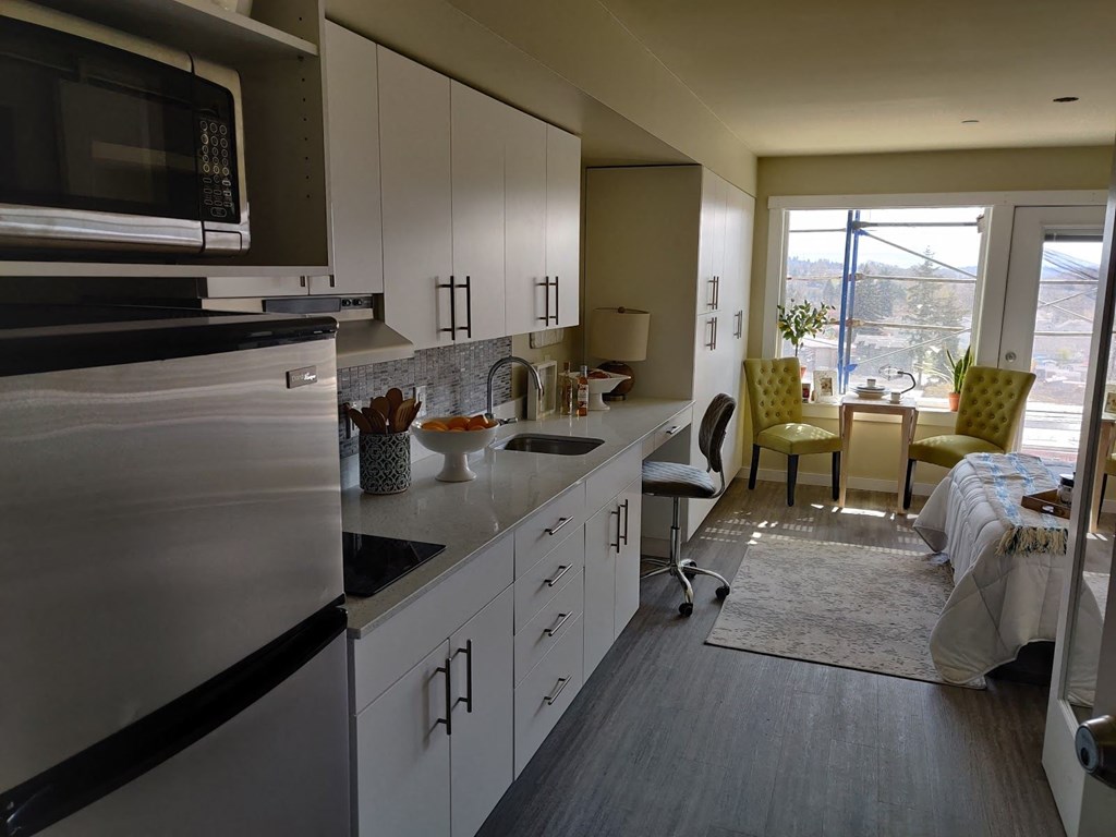a kitchen with a sink and a refrigerator