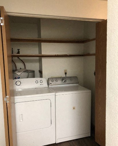 a white washer and dryer in a closet