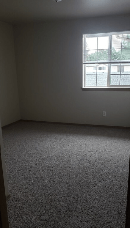 an empty room with a window in it