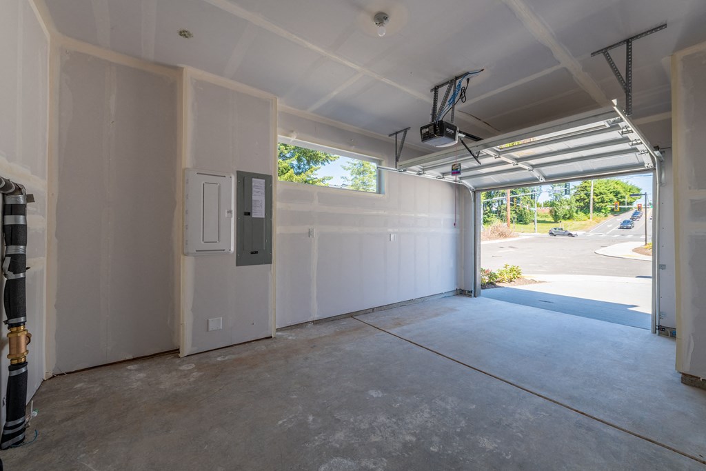 the interior of a garage with the door open