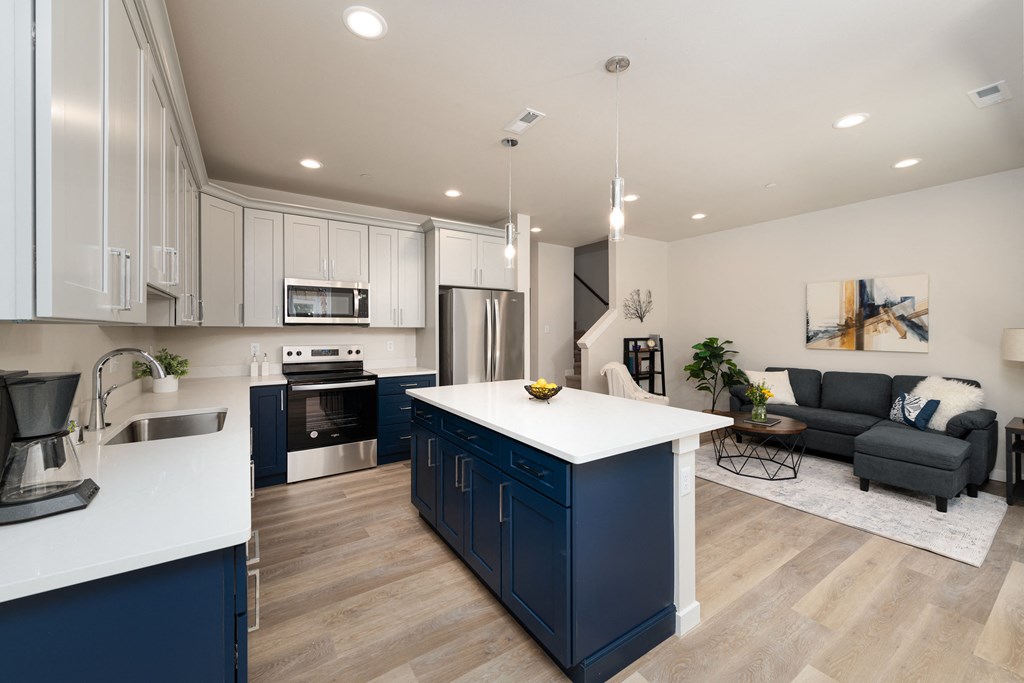A modern kitchen with a large island in the middle.