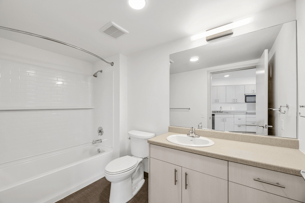 a bathroom with a sink toilet and a bath tub