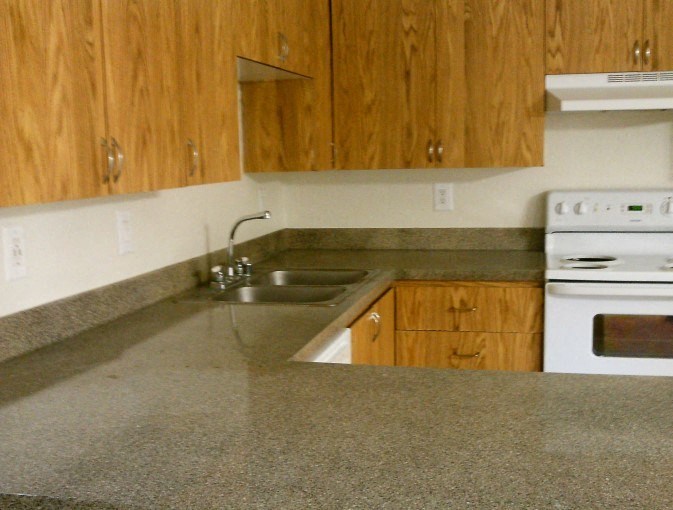 a kitchen with a counter top and a sink