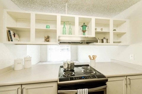 a kitchen with a stove and a counter top