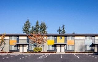 a building with a parking lot in front of it