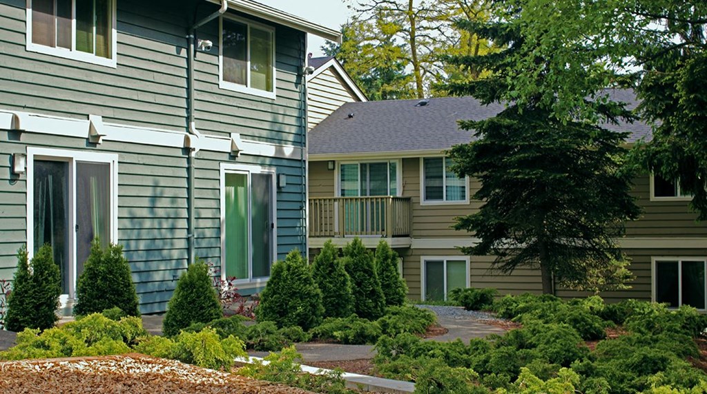the front of a house with a landscaped front yard