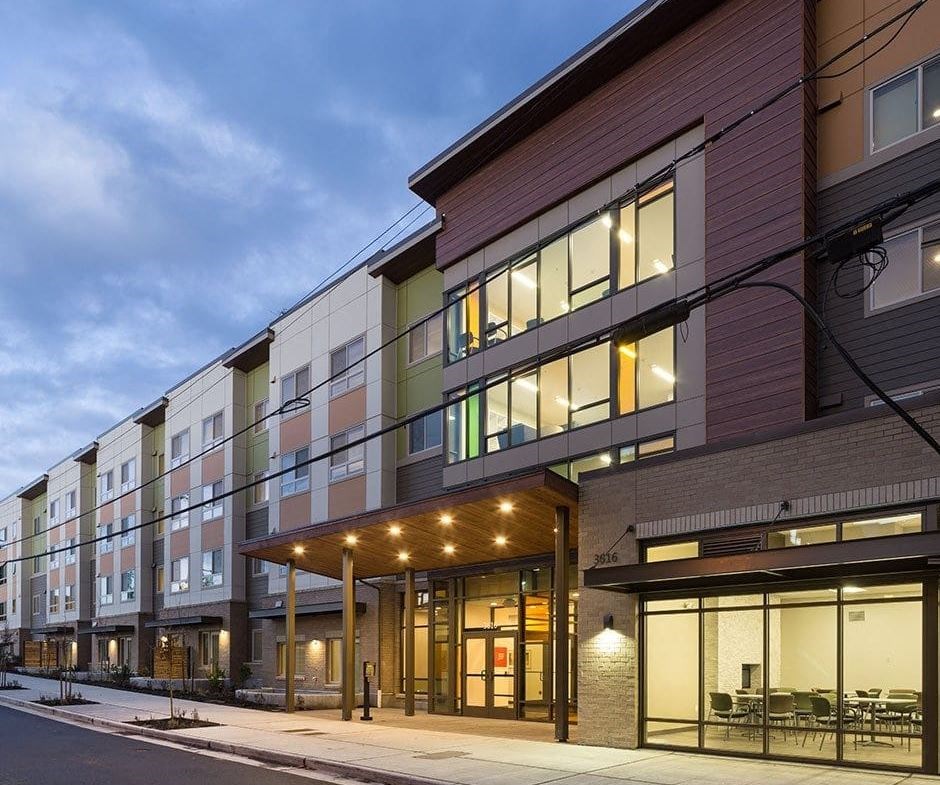the facade of a building with a street in front of it