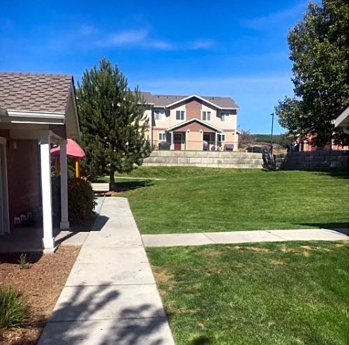 a house with a yard and a sidewalk