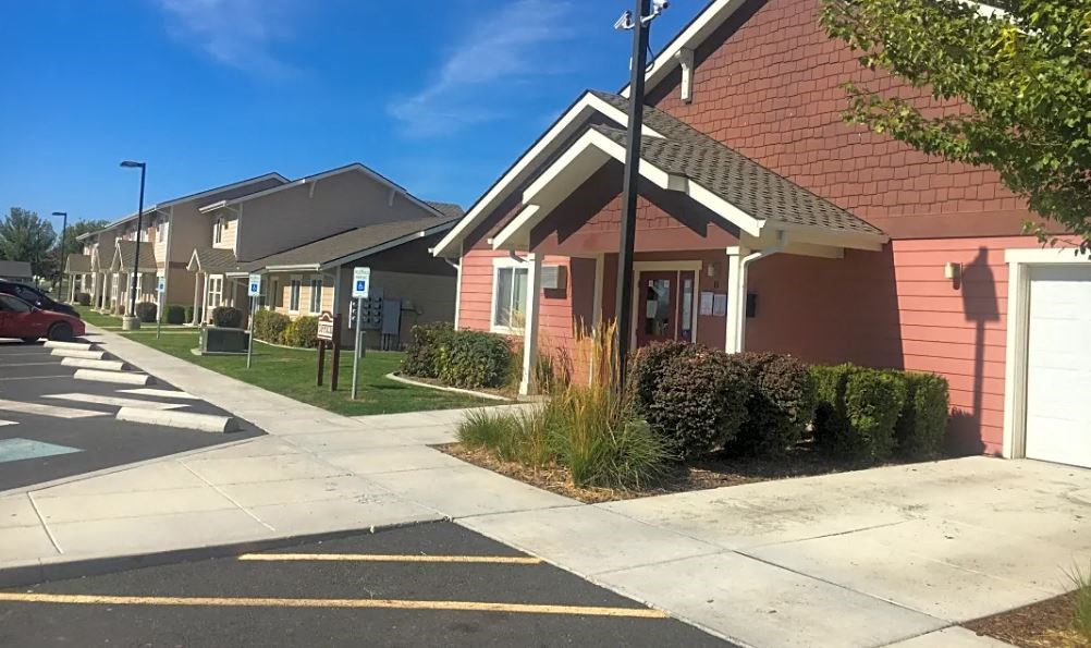 a row of houses on the side of a street