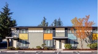 a building with a parking lot in front of it