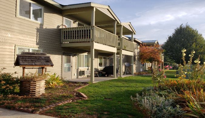 a house with a porch and a lawn