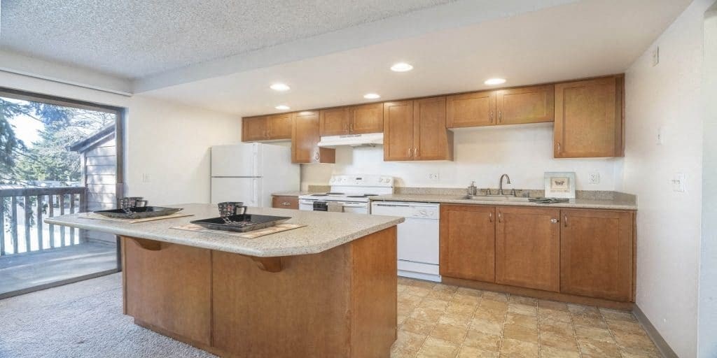 a kitchen with wooden cabinets and a counter top