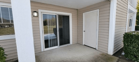 the front porch of a house with two doors