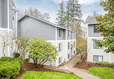 A residential area with houses and greenery.