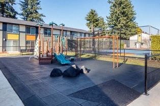 a playground at a school with some rocks on the ground