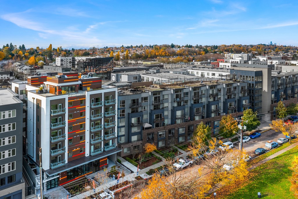 an aerial view of a city with buildings and trees