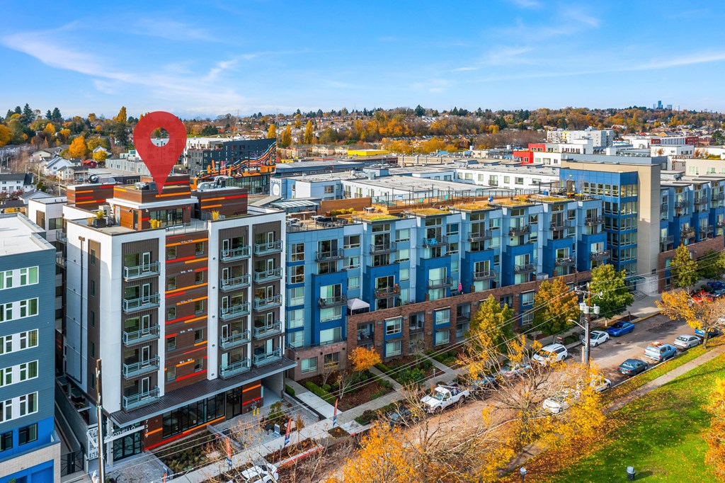 a aerial view of a city with a large red balloon on top of a building