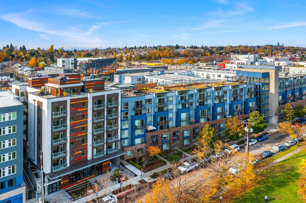 an aerial view of a city with buildings and trees