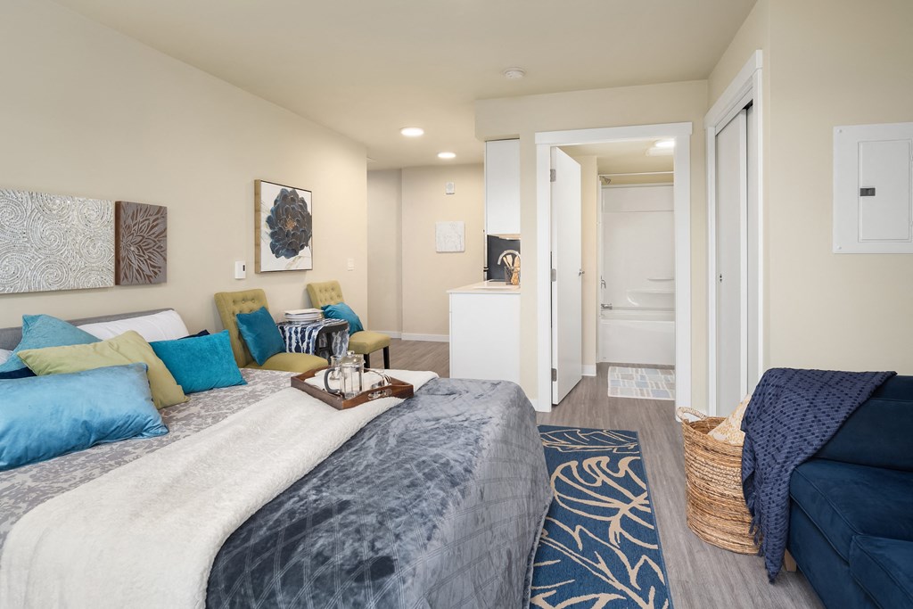 a living room with a couch and a bed