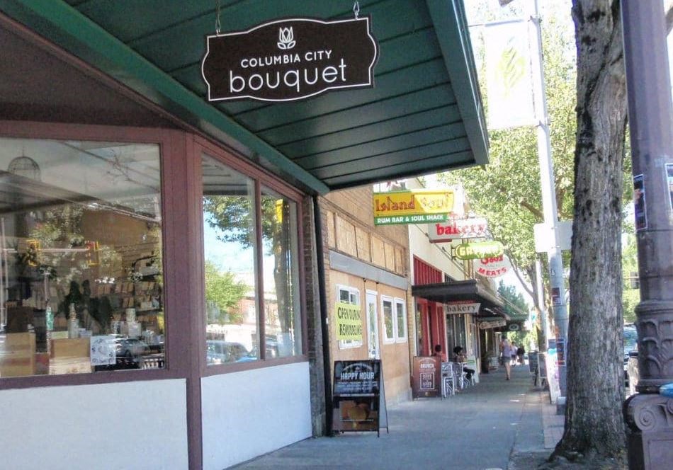 a street view of a store with a sign on it