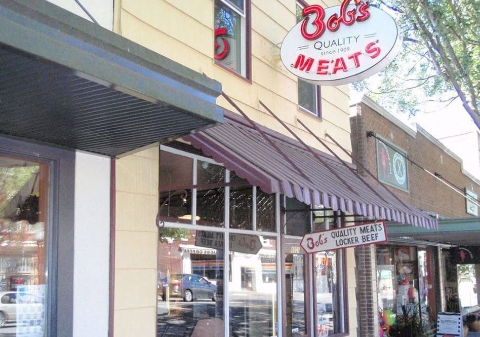 a restaurant with a sign on the side of a building