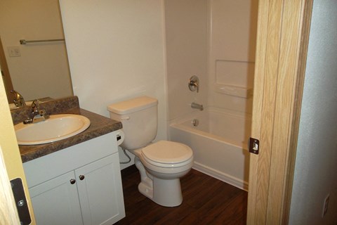 a small bathroom with a toilet sink and tub