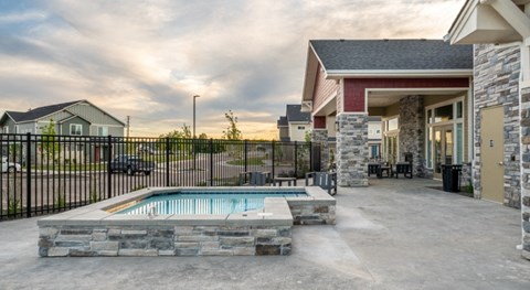 our apartments have a large patio with a pool and a house