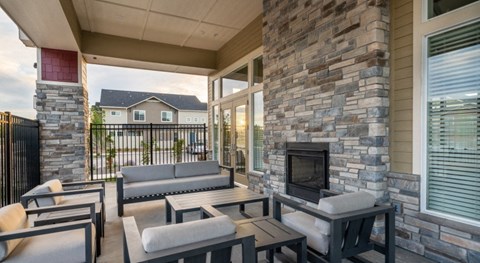 the preserve at ballantyne commons patio with couches and a fireplace