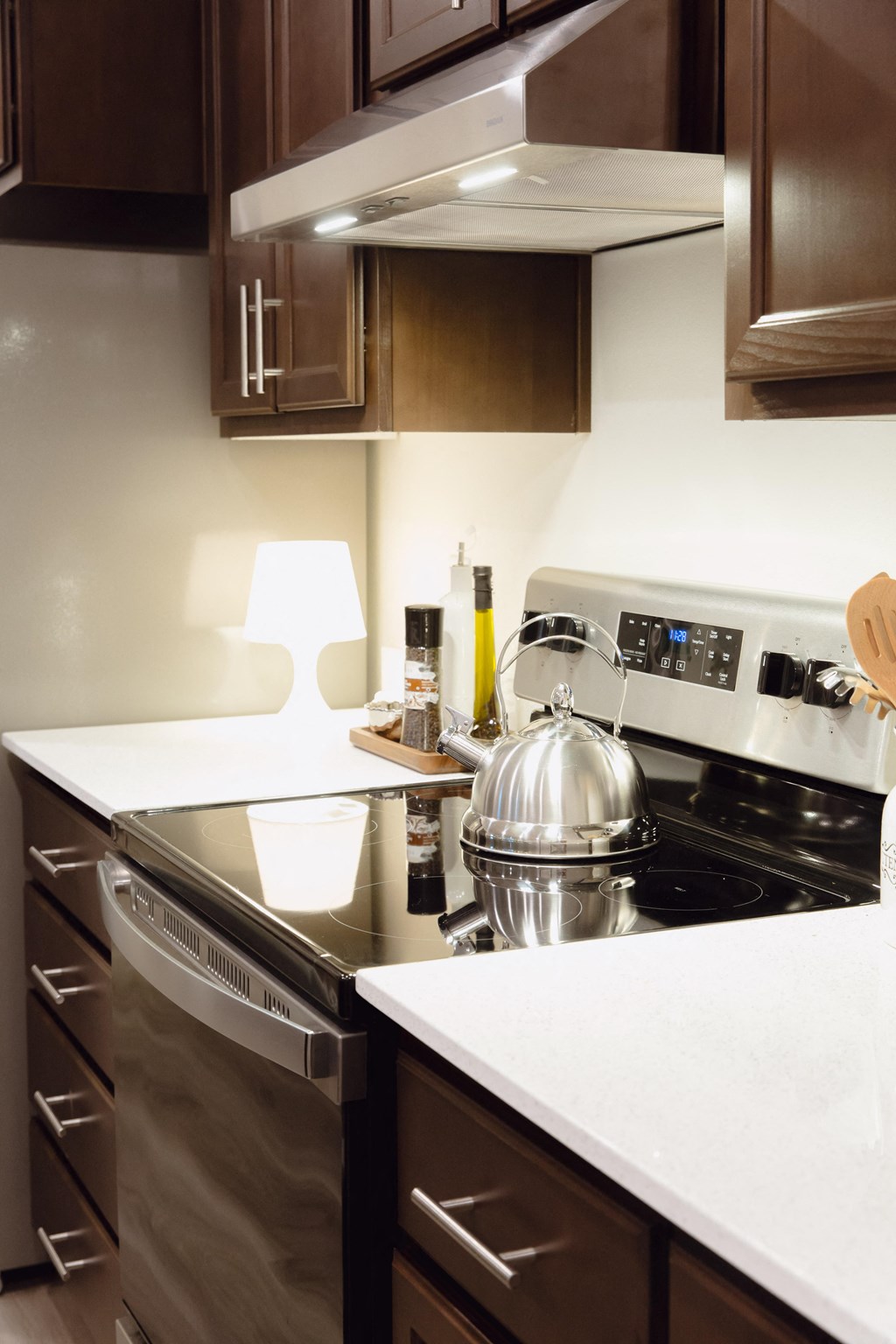 a kitchen with a stove and a kettle on the stove