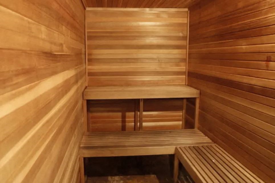 the interior of a sauna with wooden benches