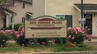 a sign in front of a house