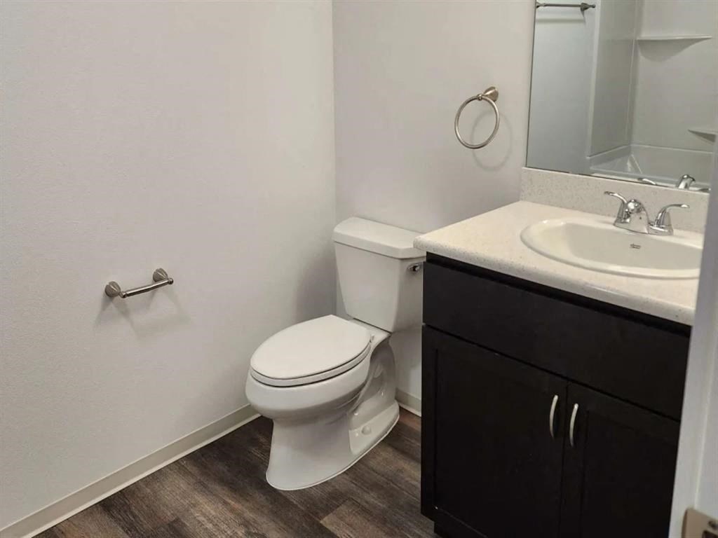 a bathroom with a toilet and a sink