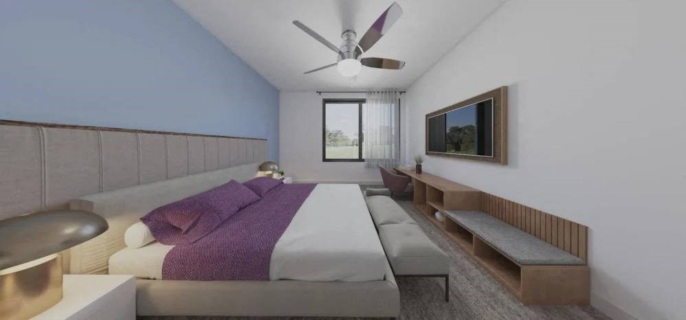 a bedroom with a bed and a ceiling fan
