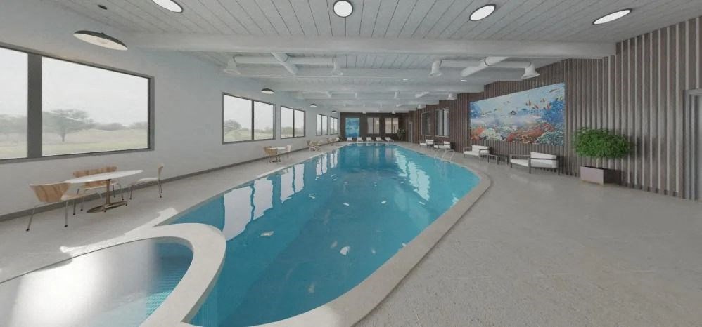 a large pool of water in a building with large windows