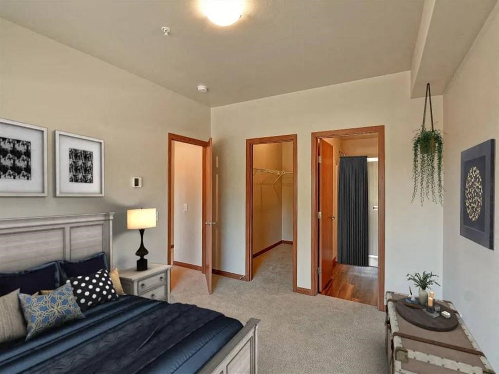 a bedroom with a bed and a closet