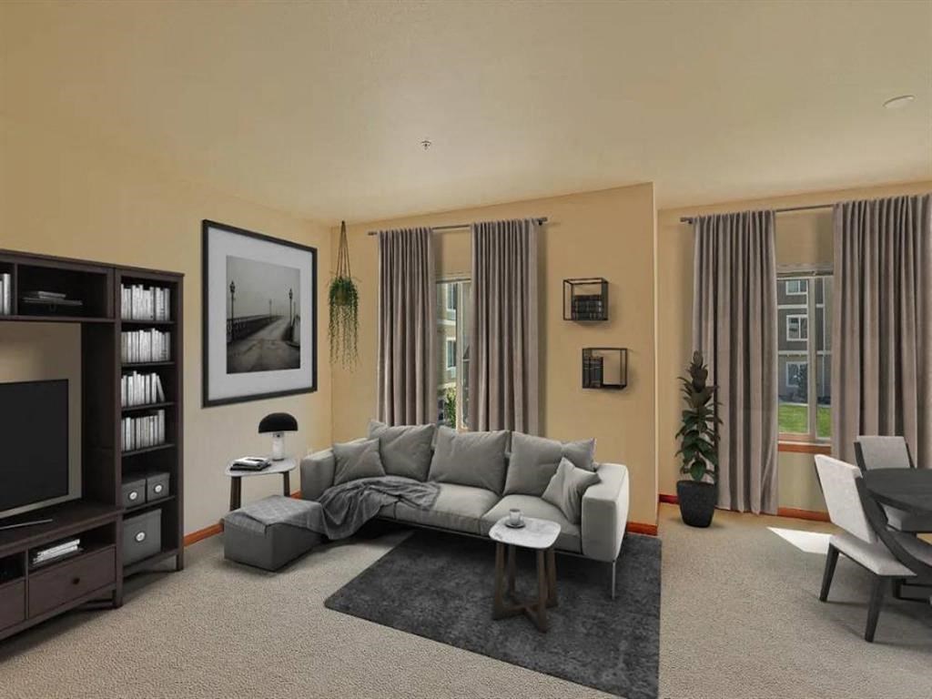 a living room with a couch and a tv