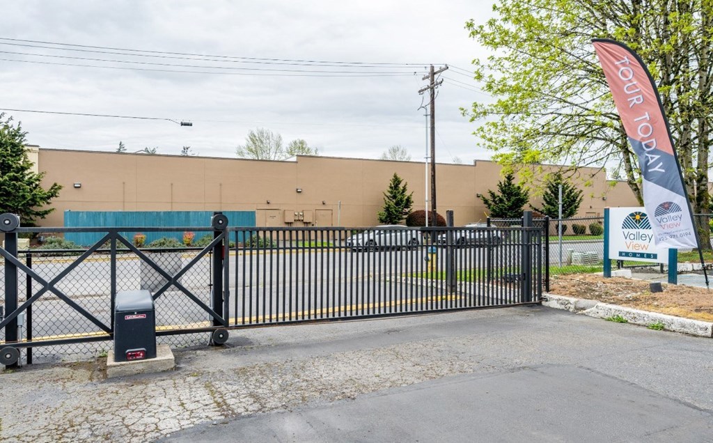 A black gate with a sign that says "Your Top 10" on it.