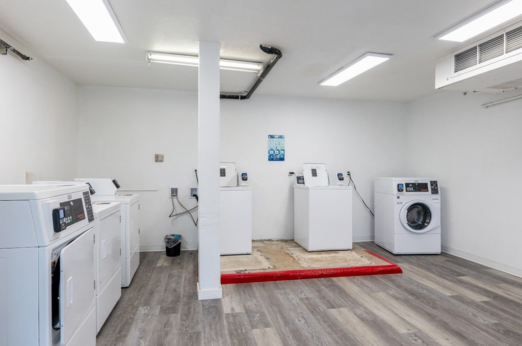 A laundry room with a washer and dryer in it.