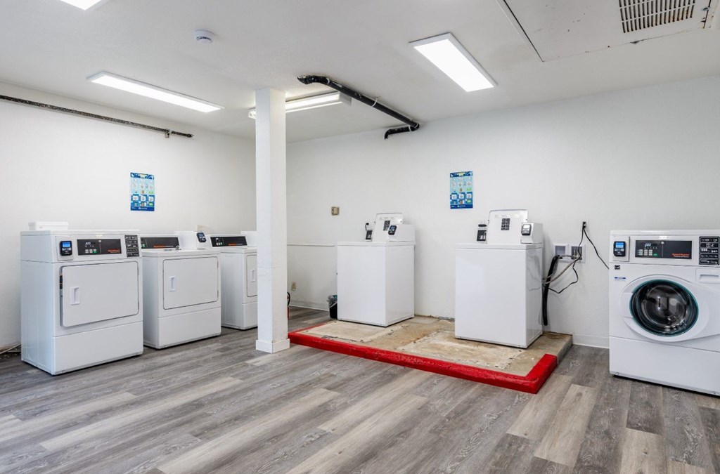 A row of washing machines in a laundromat.