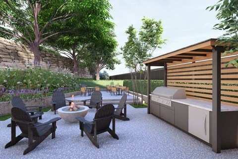 A patio with a fire pit and chairs.