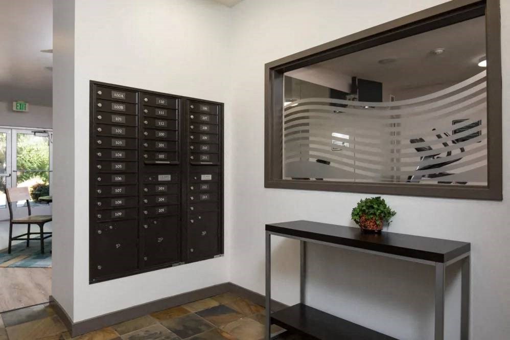 A black mailbox with the names of the recipients on it.